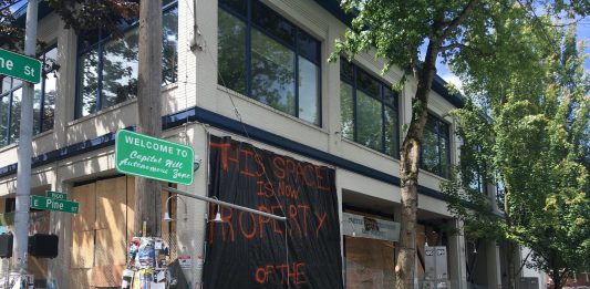 "Welcome to the Capitol Hill Autonomous Zone" reads a new sign on Pine Street. (Photo by Michael Goldman)