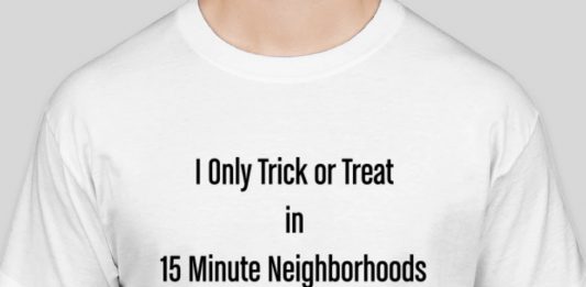 A white t-shirt reads "I only trick or treat in 15-minute neighborhoods"