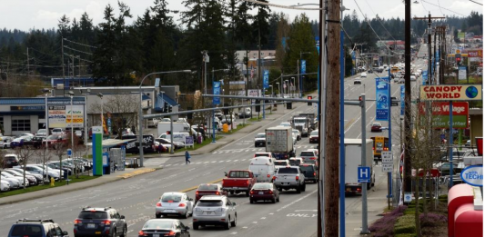 A busy state highway with narrow sidewalks