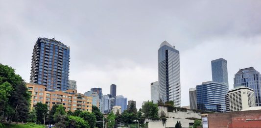 Seattle Skyline with I-5 trench and Freeway Park overhead.