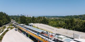 The elevated South Bellevue Station with the Bellevue skyline in the distance.