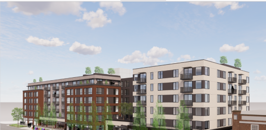 A six story apartment rendered with white siding on the corners and brick in the middle.