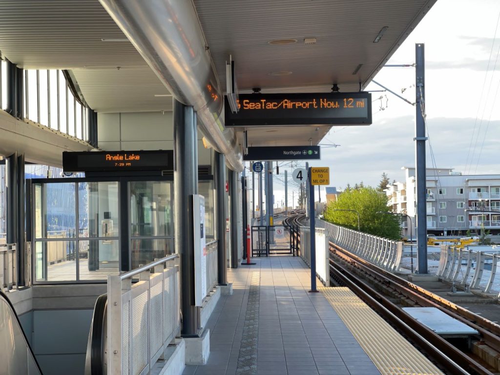 An elevated platform looking south with electronic displays showing destinations.