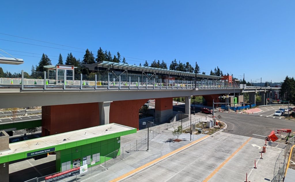 An elevated station with bus bays below.