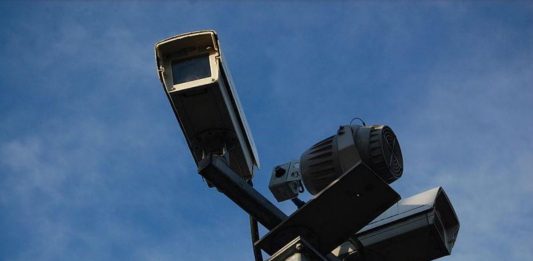 Two CCTV cameras mounted on a pole.