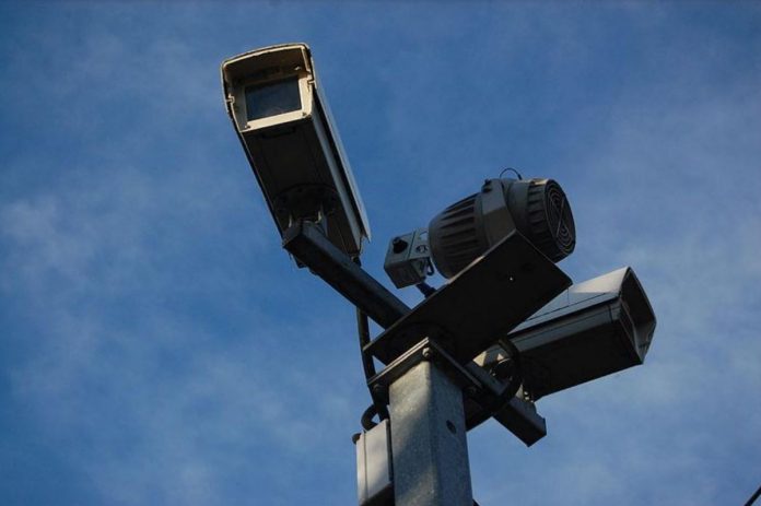 Two CCTV cameras mounted on a pole.