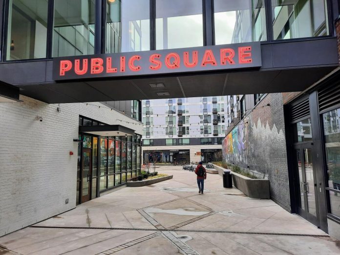 An alley leads into the interior public square of the Midtown Square complex.