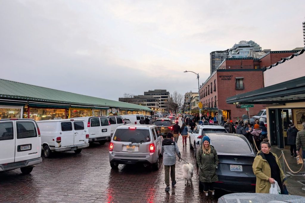 A line of red taillights from cars clogging Pike Place.