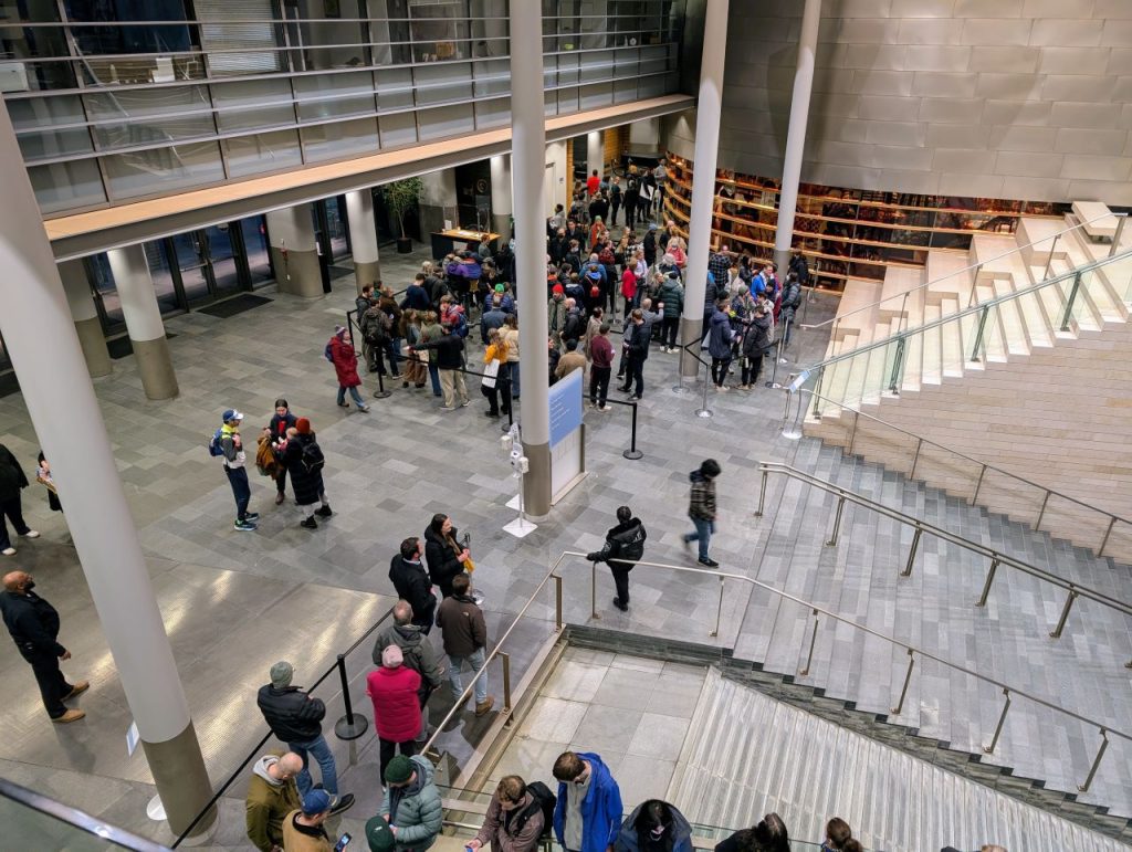 The view from the second floor as folks line up at he steps up to chambers.