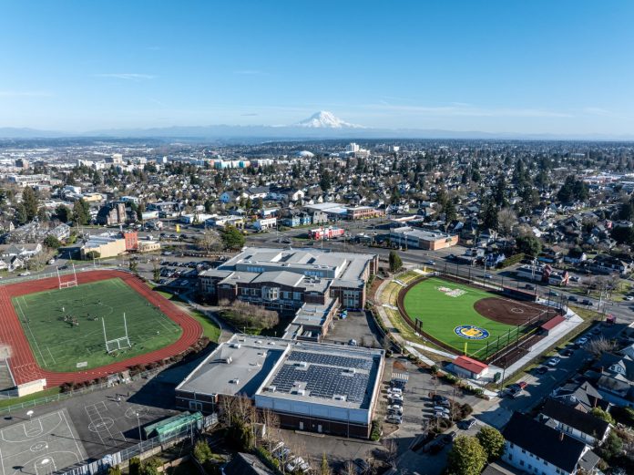 An aerial shot of North Tacoma neighborhoods with Mount Rainier and the Tacoma Dome in the distance.