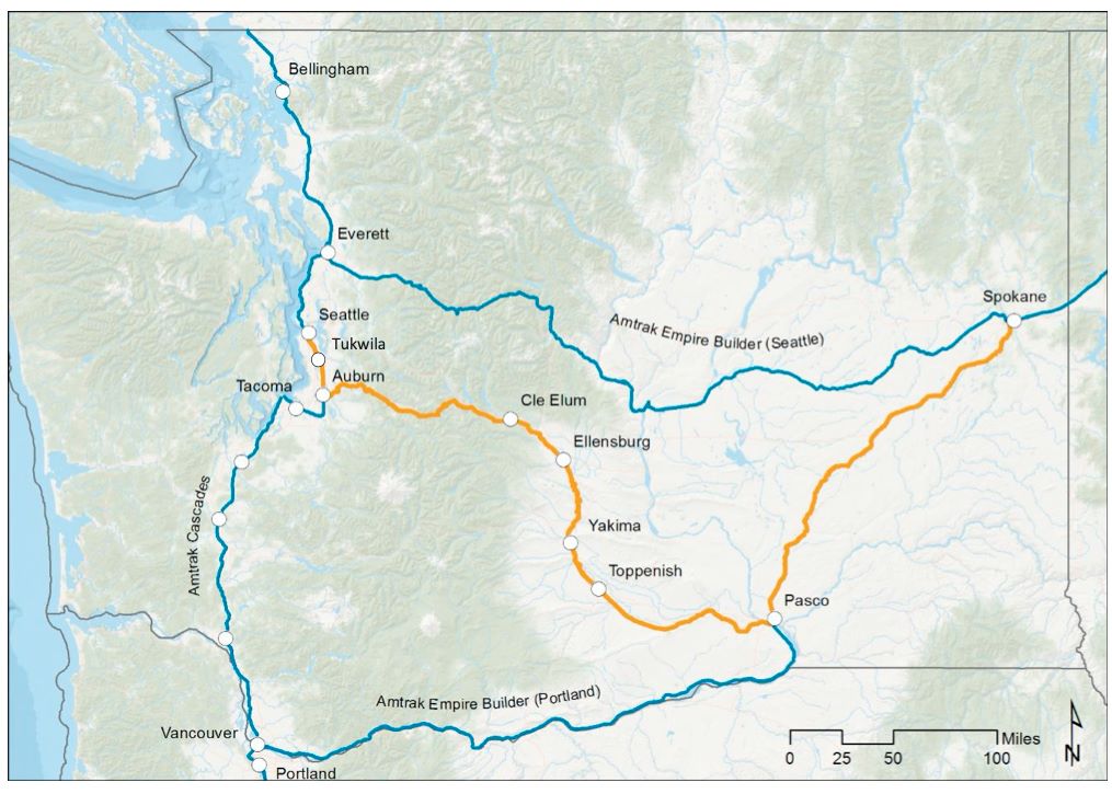 A yellow line indicates the new rail line through Stampede Pass to Yakima and Tri-Cities before hooking over to Spokane.